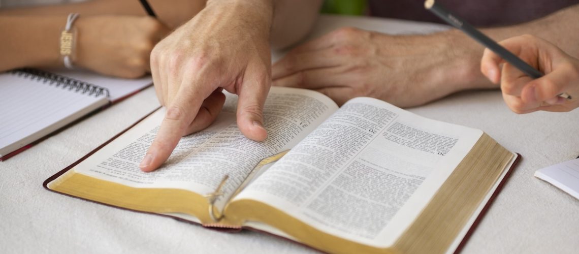 high-angle-teacher-with-bible-school